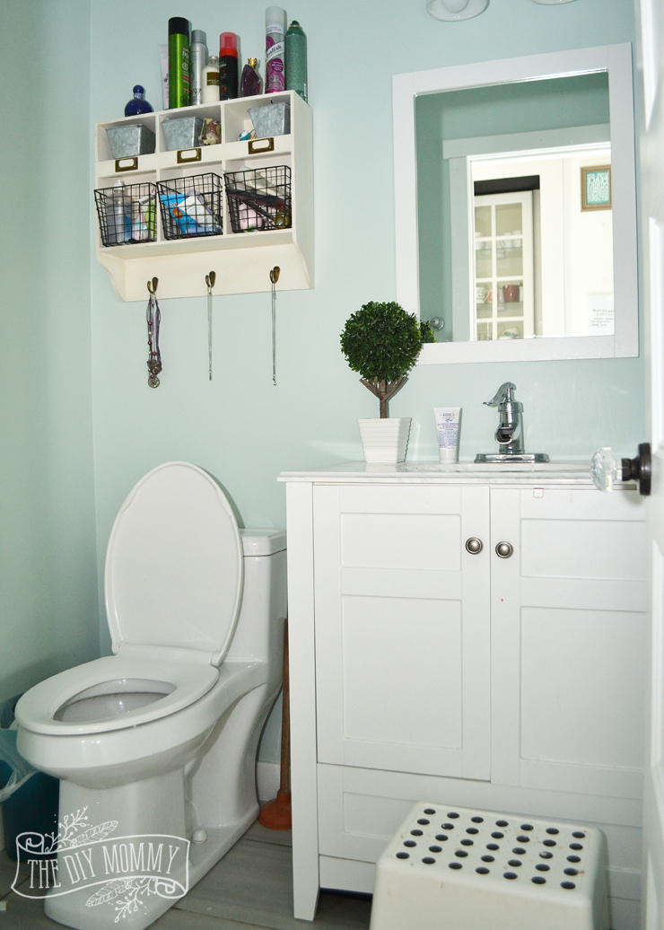 A DIY Powder Room Makeover with Chinoiserie Inspired Bird & Floral Wallpaper and Board and Batten Trim